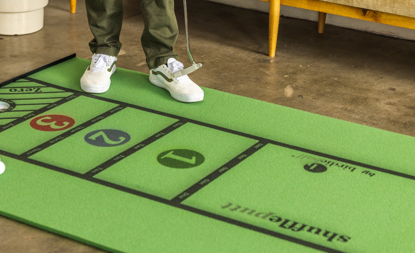 Home putting practice setup with three stations